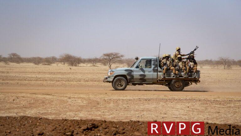 Burkina Faso soldiers aboard a pick-up truck in 2020
