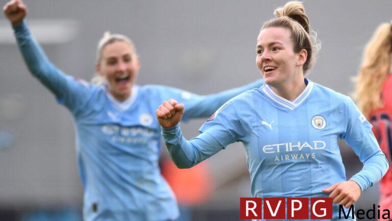 Lauren Hemp celebrates after she doubled Man City's lead over Everton