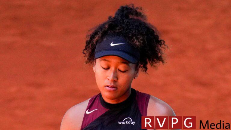 Naomi Osaka, of Japan, reacts during a match against Greet Minnen, of Belgium, at the Mutua Madrid Open tennis tournament in Madrid, Wednesday, April 24, 2024. (AP Photo/Manu Fernandez)