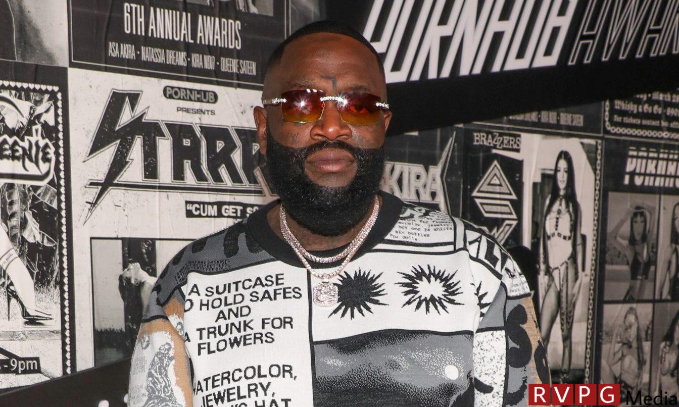 On to the next one?  Rick Ross posts himself with a woman who appears to have a tattoo of his name