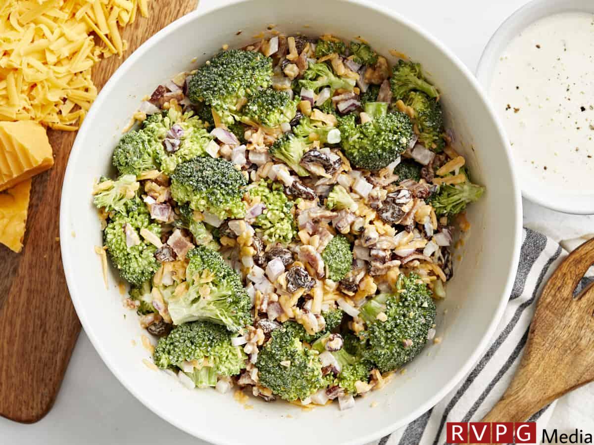 overhead view of broccoli salad in a white bowl.