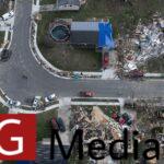 An aerial view of wreckage left behind by a tornado in a suburban neighborhood.