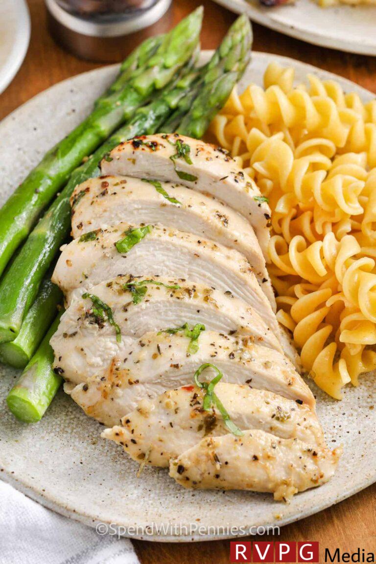 Italian Chicken Marinade on plated chicken with noodles and asparagus