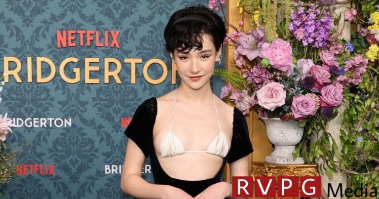 Minnie Mills highlights the exposed bra trend at the Bridgerton premiere