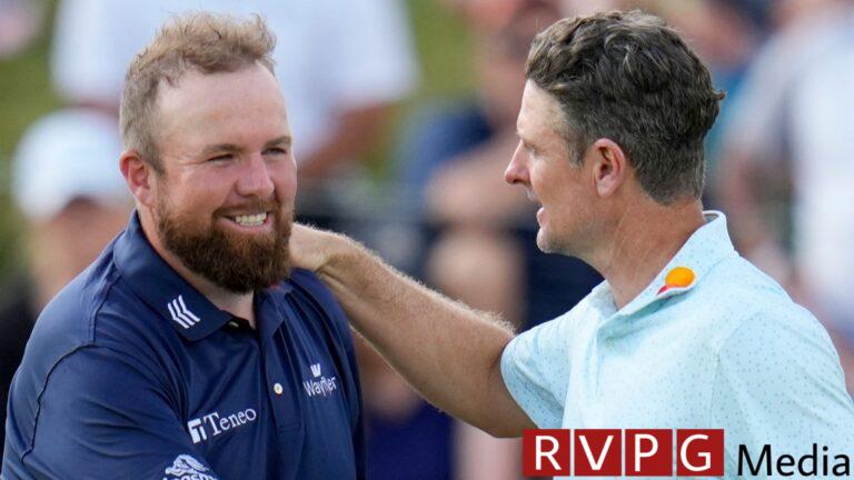 Justin Rose, of England, greets Shane Lowry, of Ireland, after the third round of the PGA Championship golf tournament at the Valhalla Golf Club, Saturday, May 18, 2024, in Louisville, Ky. (AP Photo/Jeff Roberson)
