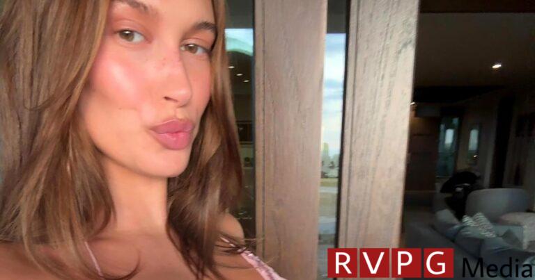 Pregnant Hailey Bieber shows off her baby bump in a sparkly butterfly top