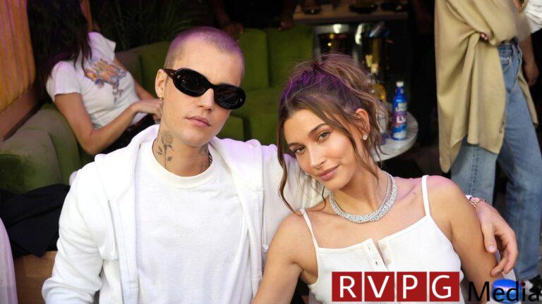 Pregnant Hailey Bieber shows off her bare baby bump while out and about with Justin