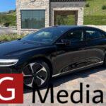 2023 Lucid Air Pure in black near stone building.