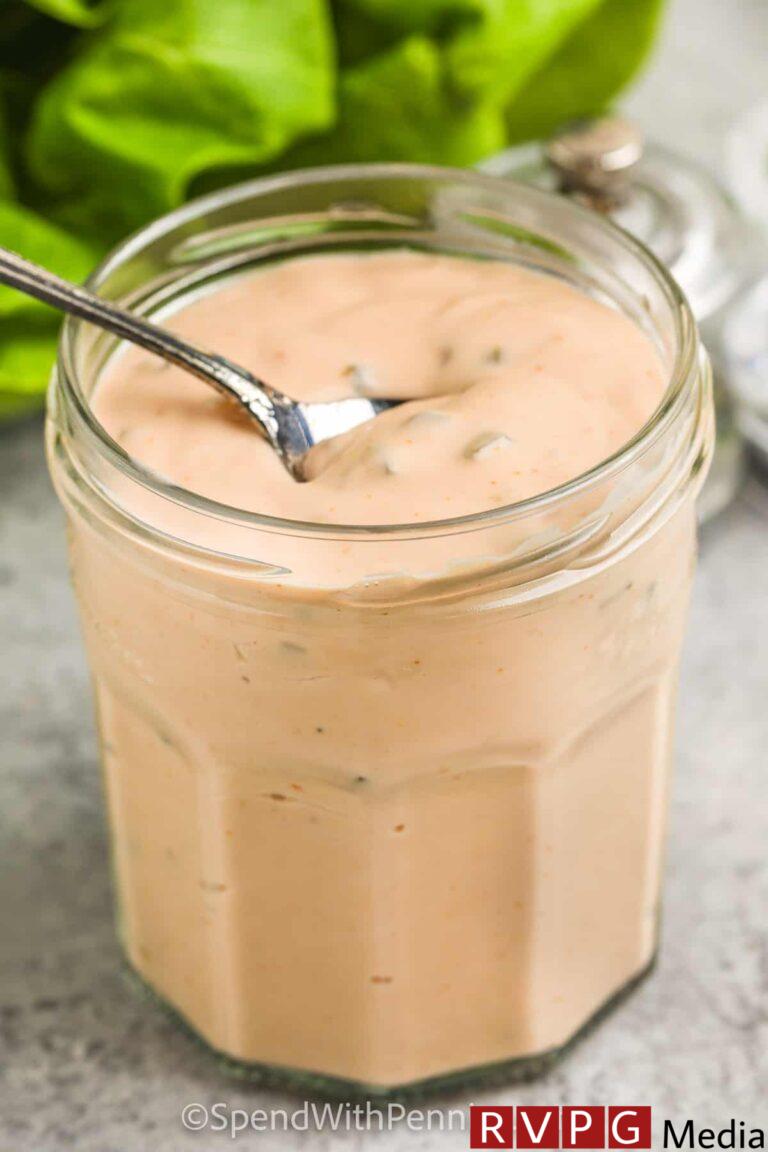 Thousand Island Dressing being scooped out of a jar