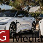 White Lucid Air with cable connecting between it and a white Tesla