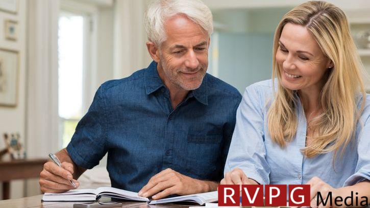 A couple goes over their projected retirement budget together.